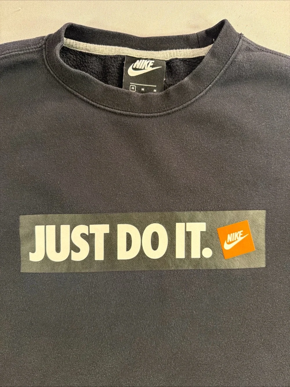 Nike Black Crewneck Sweatshirt with White 'Just Do It.' Box and Orange Tag